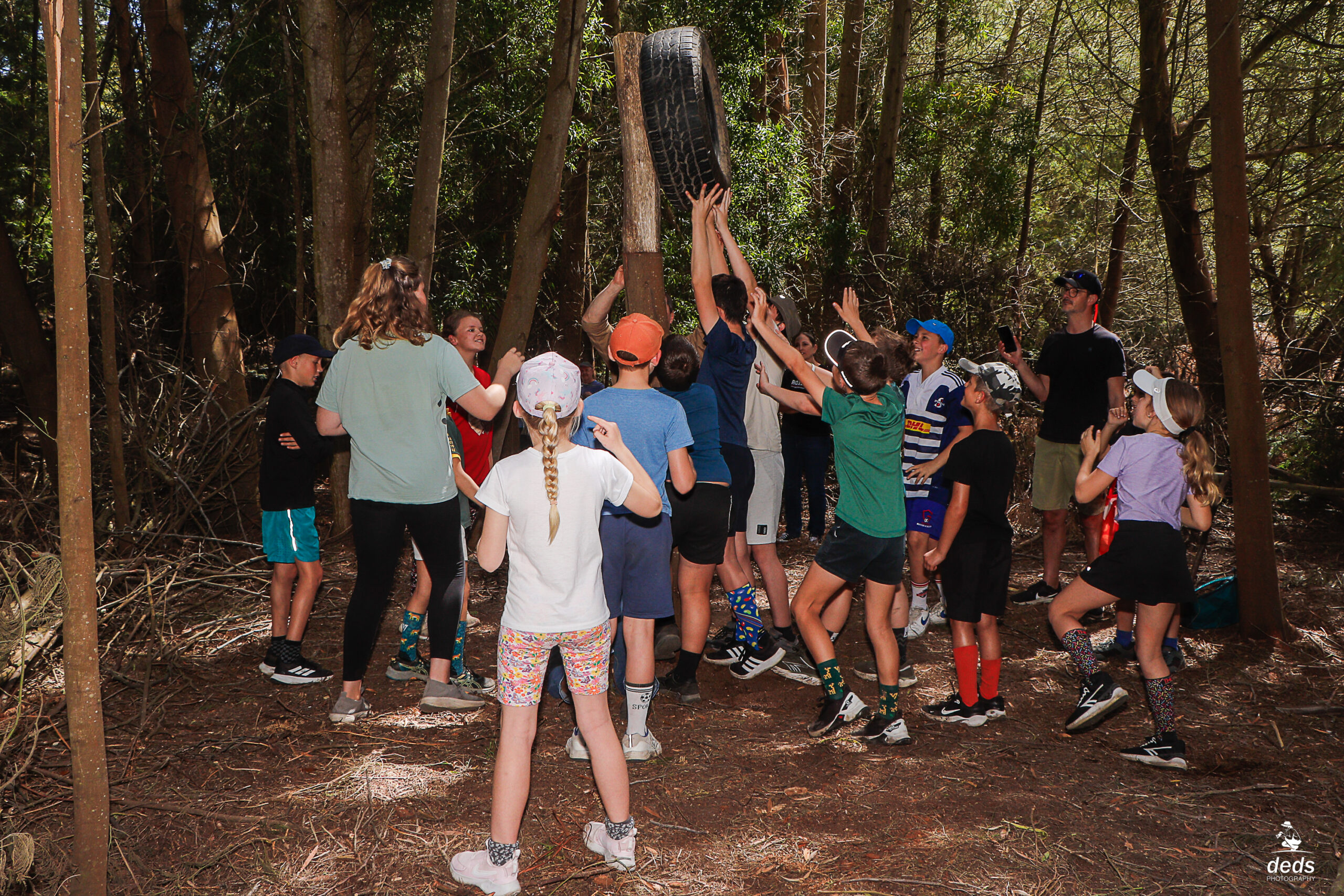 Participants learning and working together in the outdoors